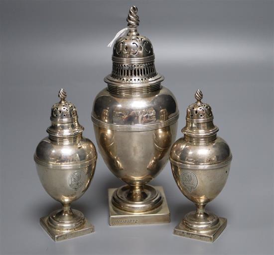 A suite of three late Victorian silver pepperettes by George Fox, London, 1899/1900, tallest 17cm, 11.5oz.